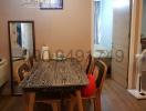 Cozy dining room with wooden table and decorative chandelier