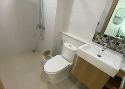 Modern white bathroom interior with shower and toilet