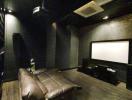 Cozy home theater room with comfortable seating and modern equipment