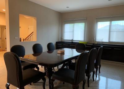 Spacious dining area with kitchen view and ample natural light