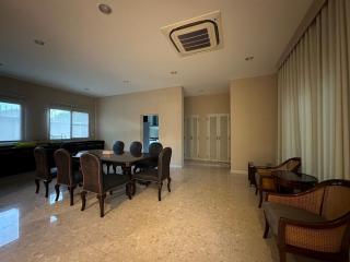 Spacious living room with dining area and marble flooring