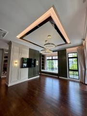 Elegant living room with high ceiling and chandelier