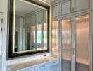 Elegant bathroom with large mirror and marble countertop