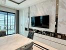 Modern living room with marble wall and built-in television