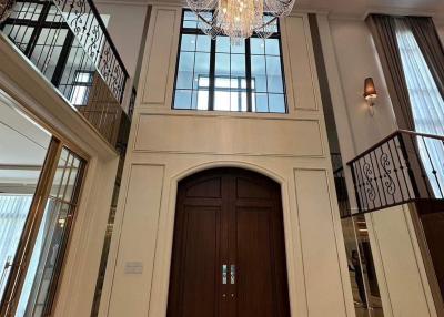 Elegant entrance hall with high ceiling and grand chandelier