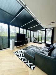 Modern living room with large windows and natural light