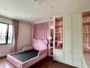 Elegant bedroom with large windows and a pink velvet bed