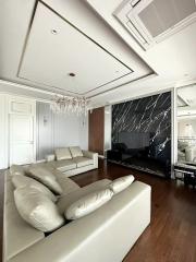 Spacious living room with large sectional sofa and modern entertainment center