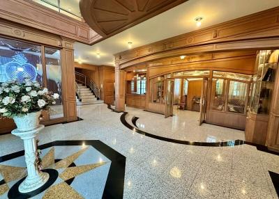 Elegant lobby interior with wooden finishes and marble flooring