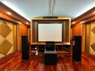 Home theater room with large screen and acoustic paneling