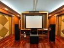 Home theater room with large screen and acoustic paneling