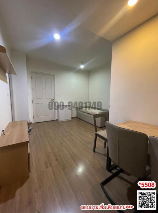 Spacious living room with dining area and wooden flooring