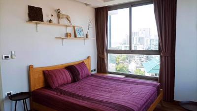 Cozy bedroom with a large window and modern decor