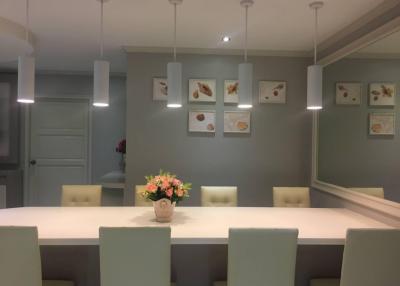 Contemporary dining room with elegant table and pendant lights