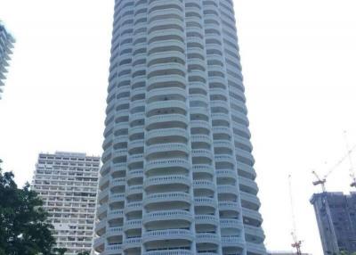 Tall residential building with multiple balconies