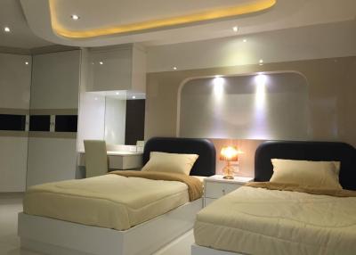 Modern double bedroom with ambient lighting