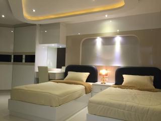 Modern double bedroom with ambient lighting