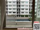 Apartment window view overlooking the swimming pool and neighboring building