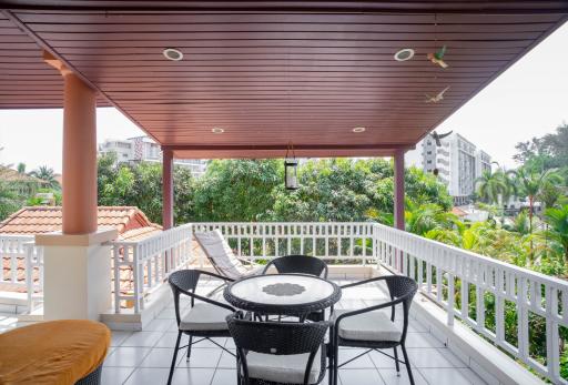 Spacious balcony with outdoor seating and urban view