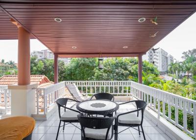 Spacious balcony with outdoor seating and urban view