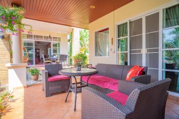 Cozy patio area with comfortable seating and direct access to the home interior
