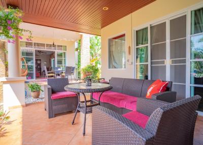 Cozy patio area with comfortable seating and direct access to the home interior