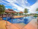 Luxurious outdoor swimming pool area with palm trees and poolside gazebo