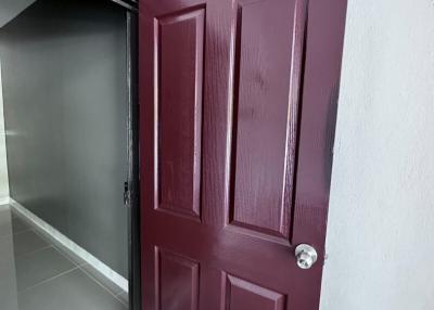 Elegant burgundy door at the home entryway