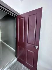 Elegant burgundy door at the home entryway