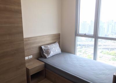 Minimalist single bedroom with a city view
