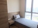 Minimalist single bedroom with a city view