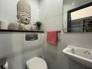Modern bathroom with Buddha statue decoration