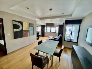 Spacious living room with dining area and modern decor