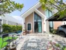 Modern house exterior with spacious garden and driveway