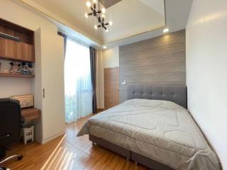 Modern bedroom with double bed and large window