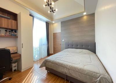 Modern bedroom with double bed and large window