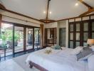 Spacious bedroom with sliding glass doors leading to the pool area
