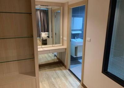 Modern bedroom with en-suite bathroom and wooden flooring