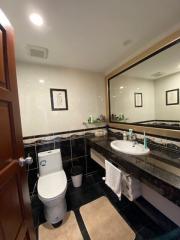 Modern bathroom with white walls and black accents