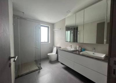 Modern bathroom interior with glass shower booth and double vanity