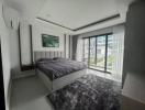 Modern bedroom with a large bed and natural light