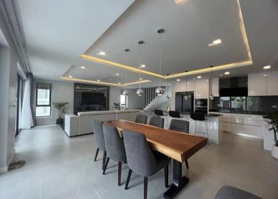 Modern open-plan living space with integrated kitchen and dining area