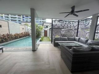 Modern patio with pool and seating area