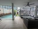 Modern patio with pool and seating area