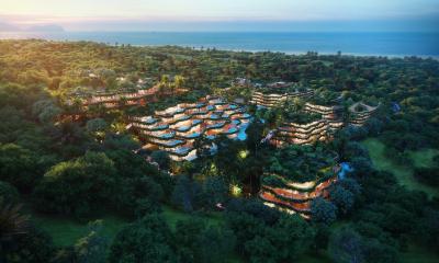 Aerial view of a luxury resort community surrounded by lush greenery