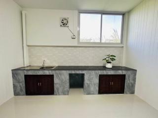 Modern kitchen with marble countertop and minimalist decor