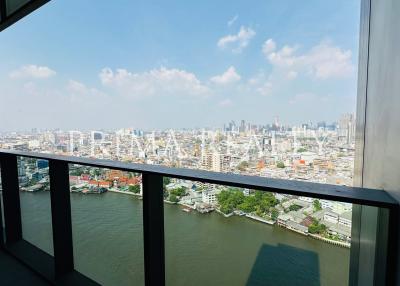 Panoramic city view from a high-rise balcony overlooking a river