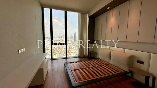 Modern bedroom with floor-to-ceiling windows and city view