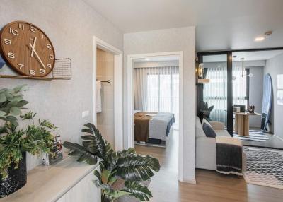 Modern entryway leading to a cozy bedroom and living room