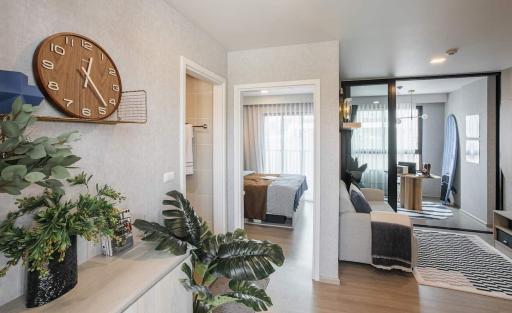 Modern entryway leading to a cozy bedroom and living room